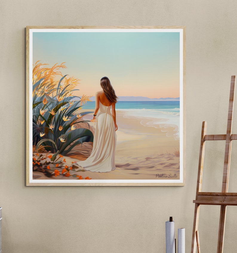 May include: A painting of a woman in a white dress standing on a beach with her back to the viewer. She is looking out at the ocean. There are tall, yellow grasses and orange flowers in the foreground. The sky is a light blue and the water is a turquoise blue. The painting is signed "Marina Scilla" in the bottom right corner.