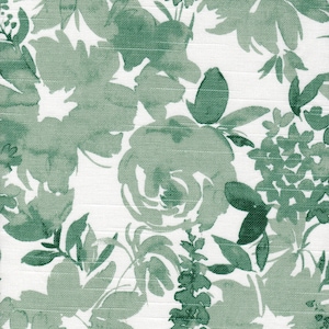 May include: A floral pattern featuring watercolor-style green flowers and foliage on a white background. The design includes various flower shapes and leaf arrangements, creating a botanical theme. The fabric has a textured appearance.