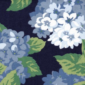 May include: A fabric pattern featuring clusters of hydrangea flowers in shades of white, light blue, and medium blue, interspersed with green leaves against a solid dark navy blue background. The floral design repeats across the textile surface.