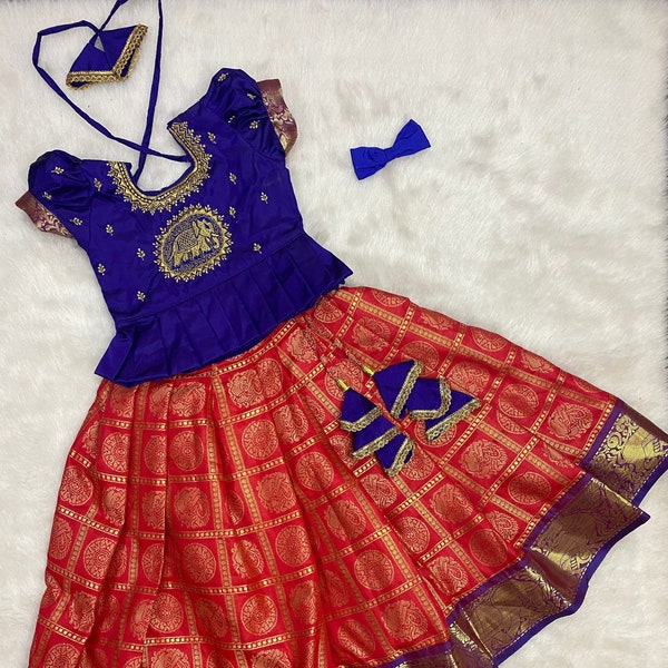 Custom made Banarasi silk Lehenga paired with beautiful embroidery work blouse and matching clips.