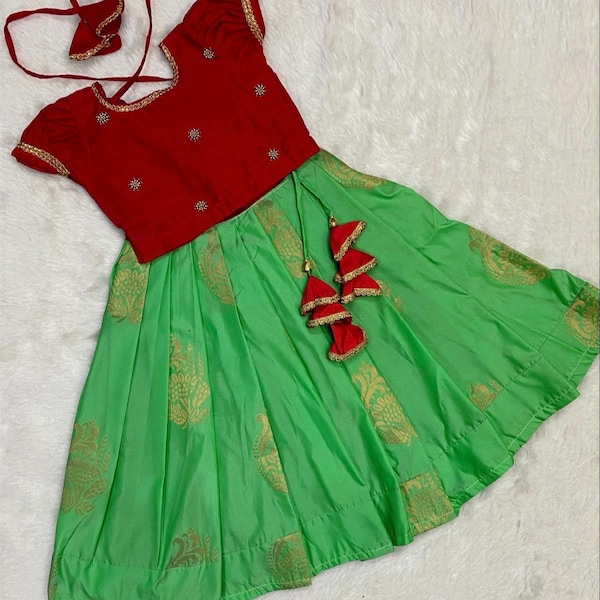 Custom made soft silk lehenga paired with maggam work blouse and matching clips.