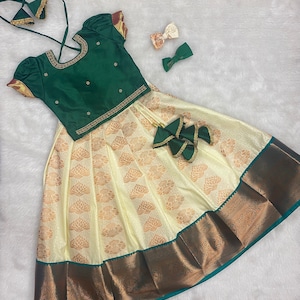 custom made kanchi pattu lehanga paired  with beautiful Maggam work blouse. Free Matching clips.