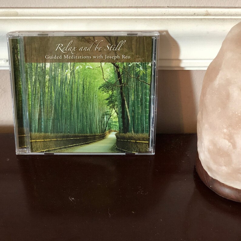 May include: A CD case with a green bamboo forest image and the text "Relax and be Still Guided Meditations with Joseph  Leo"