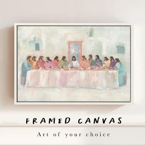 May include: Framed canvas art featuring a pastel-colored depiction of the Last Supper. The painting shows a long table with figures in robes, set against a soft, light-colored background. The text "FRAMED CANVAS" and "Art of your choice" are at the bottom.