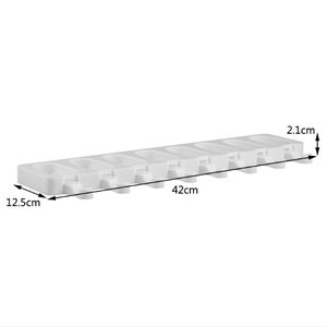 May include: White silicone popsicle mold with eight individual molds. The mold measures 12.5 inches long by 2.1 inches wide and 42 centimeters long.