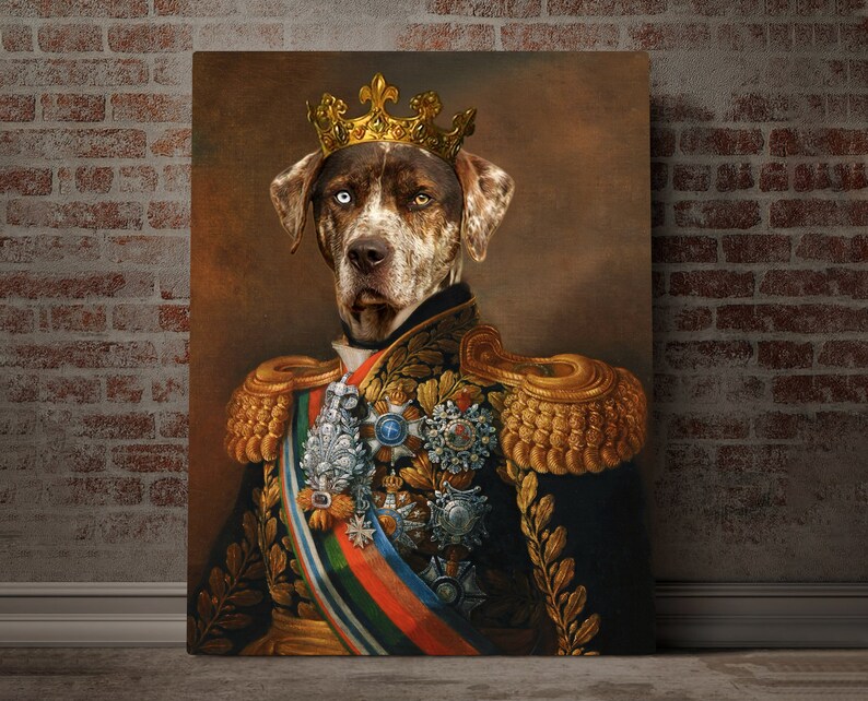 May include: A brown and white dog wearing a gold crown and a military uniform with gold trim and medals. The dog is looking directly at the viewer.