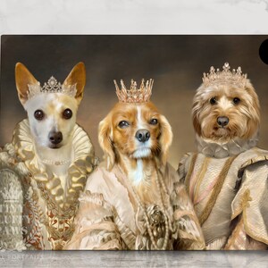 May include: Three dogs dressed in royal attire, wearing gold crowns and ornate clothing. The dogs are a chihuahua, a cavalier king charles spaniel, and a goldendoodle. The background is a muted brown.