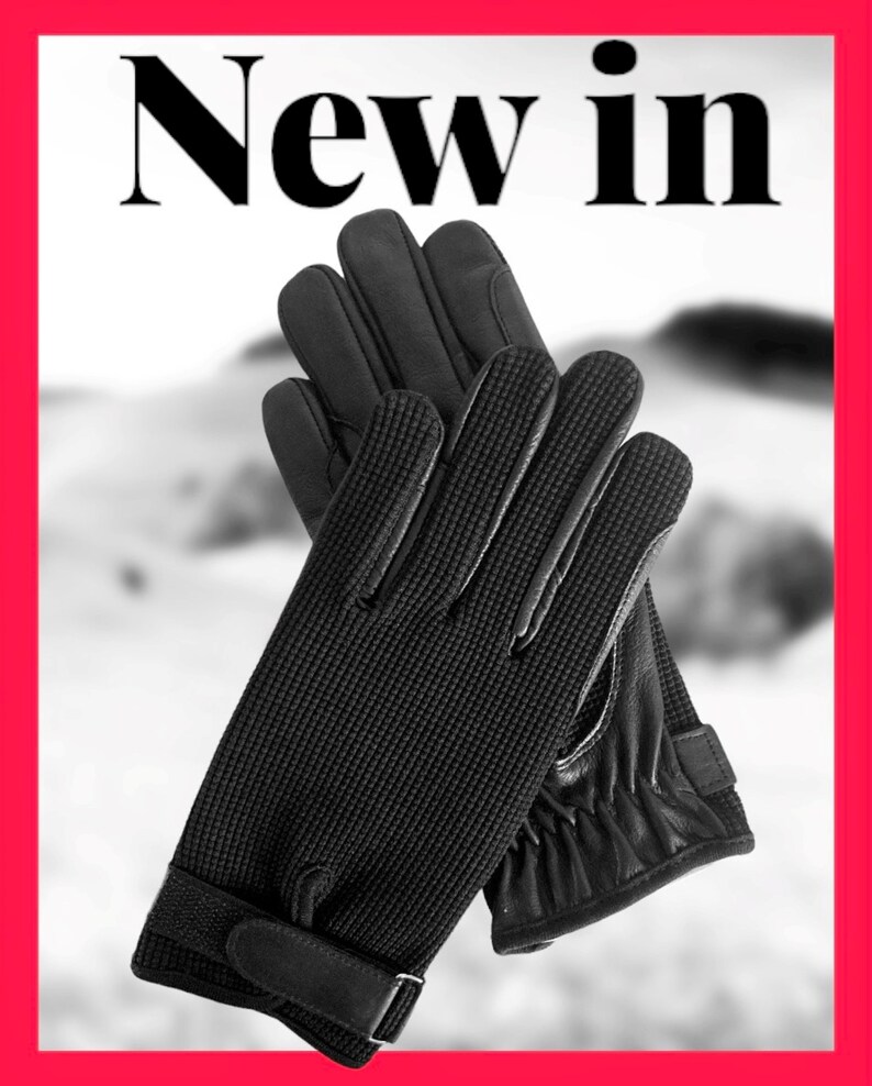 May include: A pair of black leather gloves with a textured knit back and a leather palm. The gloves have a strap with a buckle on the wrist.