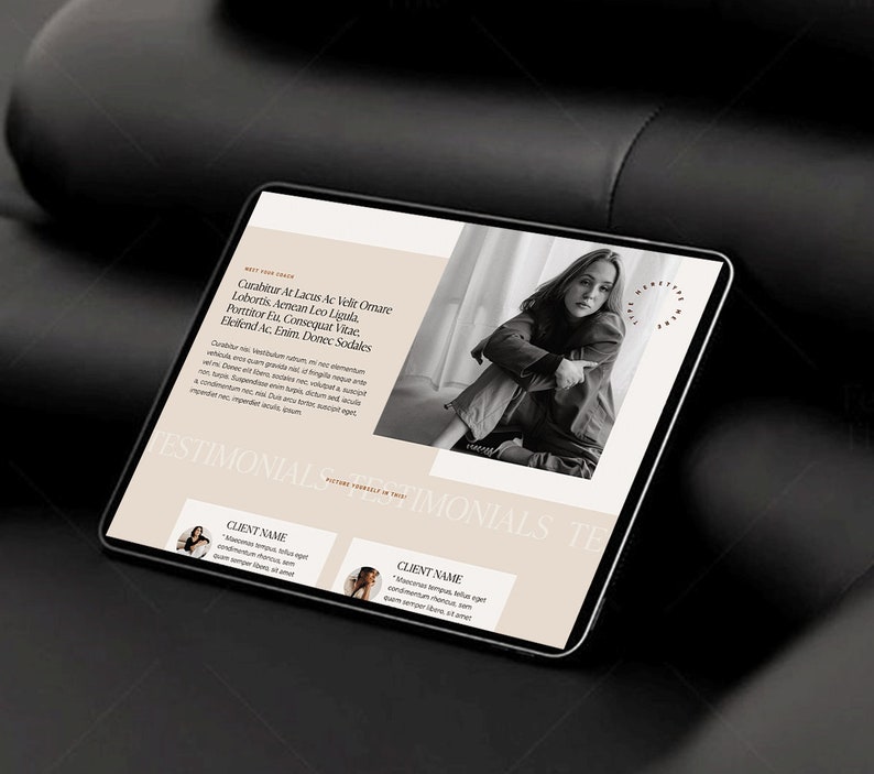 May include: A digital tablet displaying a website mockup with a beige and white color scheme. The website features text, a black and white photo of a person, and the word "TESTIMONIALS". The tablet is on a dark surface.