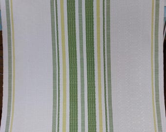 May include: White kitchen towel with green and yellow stripes. The stripes are woven into the fabric.