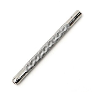 May include: A silver metal punch tool with a textured handle. The tool is approximately 15 cm long.