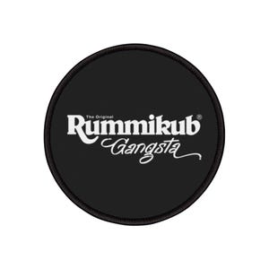 May include: Black and white round patch with the text "The Original Rummikub Gangsta" in white lettering.
