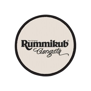 May include: A white round patch with black text that reads "The Original Rummikub Gangsta" with a registered trademark symbol.