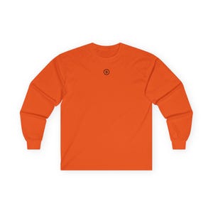 May include: Orange long-sleeved t-shirt with a small black circle containing the letter "B" on the chest.
