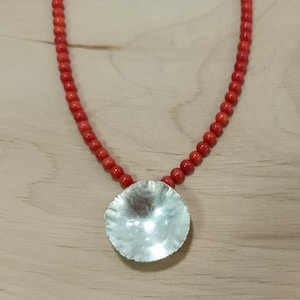 Silver pendant, half shell shape, hand forged, on red bamboo coral chain