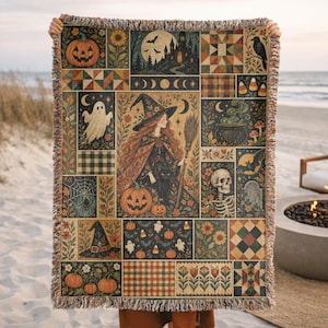 May include: A woven throw blanket featuring a multi-panel Halloween design with a central witch, a black cat, pumpkins, a ghost, a skeleton, a haunted castle, bats, and floral patterns. The blanket has a fringed edge and a rich, autumnal color palette.