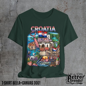 A Green T-shirt featuring a colorful graphic design of Croatia landmarks and symbols, including a Dalmatian dog, necktie, Mediterranean coast, and historic architecture, displayed on a textured grey background.