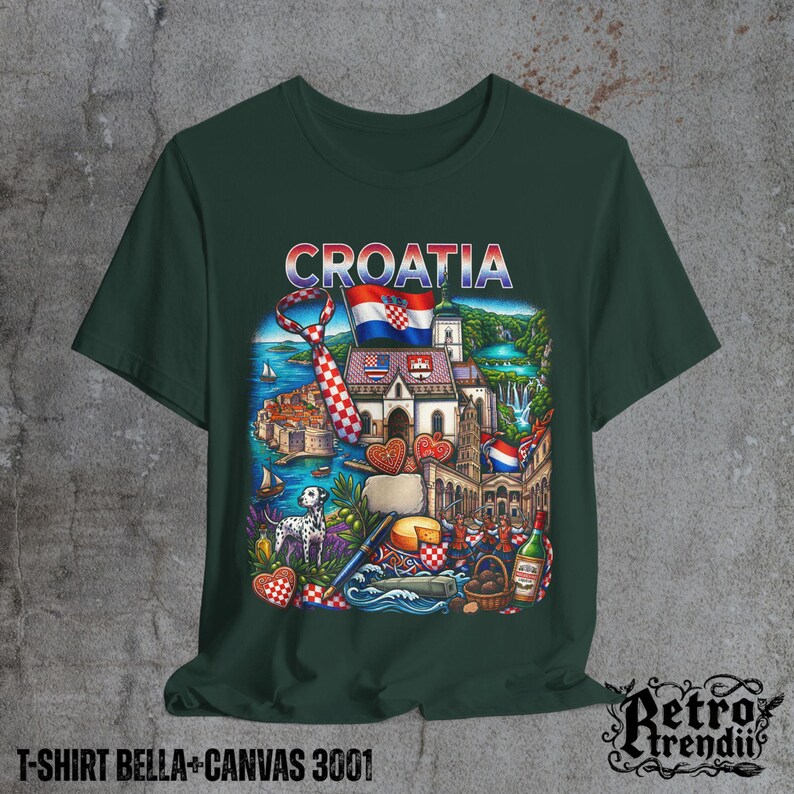 A Green T-shirt featuring a colorful graphic design of Croatia landmarks and symbols, including a Dalmatian dog, necktie, Mediterranean coast, and historic architecture, displayed on a textured grey background.