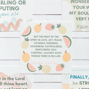 May include: Four colorful printable cards with inspirational quotes and bible verses. The cards feature a pink, yellow, and green color scheme with fruit illustrations. The text on the cards includes: "All things without grumbling or disputing", "But the fruit of the spirit is love, joy, peace, patience, kindness, goodness, faithfulness, gentleness, self-control; against such things there is no law. Galatians 5:22-23", "Trust in the Lord with all thine heart, and lean not unto thine own understanding. Proverbs 3:5", and "Finally, be strong in the Lord and in the power of his might. Ephesians 6:10".