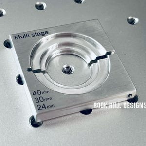 May include: A silver metal multi-stage jig with three different sized circles, labeled 40mm, 30mm, and 24mm. The jig is labeled "Multi stage" and "ROCK HILL DESIGNS".