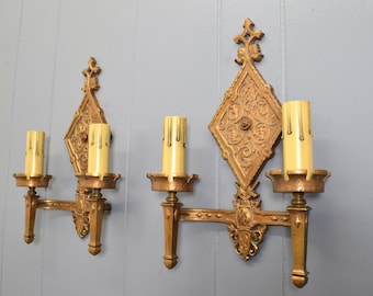 Pair Original Bronze Oscar Bach Style Antique Wall Sconce Lights Circa 1920 With Unicorn and Heraldic Details Rewired And Ready To Install