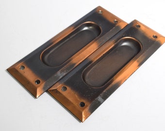 Pair of Sliding Door Cup Escutcheons Circa 1920 With Elegant Rectangular Shape, Beveled Edge, and Japanned Finish