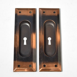 Pair of Keyed Pocket Door Pulls Circa 1920 With Elegant Rectangular Shape, Beveled Edge, and Japanned Finish image 1