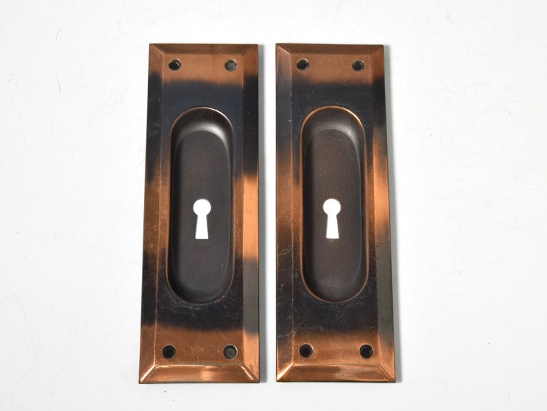 Pair of Keyed Pocket Door Pulls Circa 1920 With Elegant Rectangular Shape, Beveled Edge, and Japanned Finish image 1