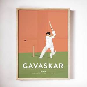May include: A framed print featuring a cricket player in action, set against a green and orange backdrop. The print includes the name "Gavaskar" and the text "India International Cricket Icon". The artwork is in a minimalist style.