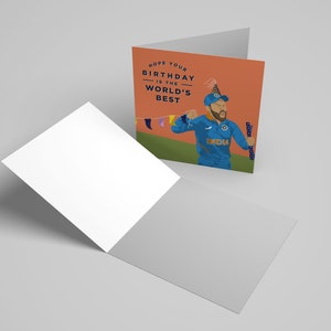 May include: A birthday card featuring a cartoon illustration of a cricket player wearing a blue jersey with the word "INDIA" on it. The player is holding a bat and wearing a party hat. The card has the text "HOPE YOUR BIRTHDAY IS THE WORLD'S BEST" on it.