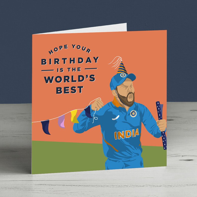 May include: A birthday card featuring a cartoon illustration of a man wearing a blue and orange jersey with the word "INDIA" on it. He is holding a party popper and a string of colorful flags. The text on the card reads "Hope your birthday is the world's best."