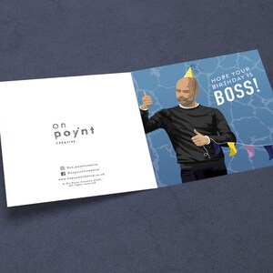 May include: A birthday card featuring a cartoon illustration of a man wearing a party hat and giving a thumbs up. The card has a blue background with a white border and the text "Hope your birthday is BOSS!" in white letters.
