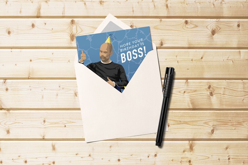 May include: A birthday card with a cartoon illustration of a person wearing a party hat and giving a thumbs up. The card has the text "Hope your birthday is BOSS!"