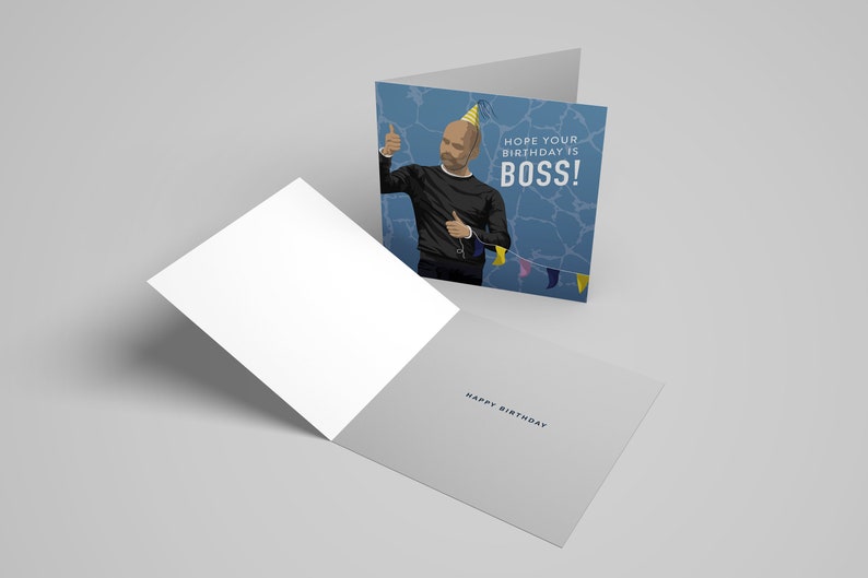 May include: A blue birthday card with a cartoon illustration of a man wearing a party hat and giving a thumbs up. The text on the card reads "Hope your birthday is BOSS!" and "Happy Birthday".