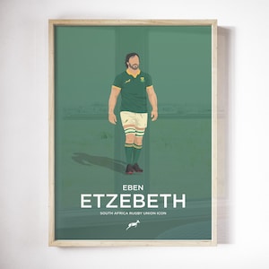 Puede incluir: Una impresión enmarcada con una ilustración estilizada de Eben Etzebeth, un icono de la unión de rugby de Sudáfrica. La obra de arte representa a Etzebeth con un uniforme de rugby verde y dorado, de pie sobre un campo verde. La impresión incluye el nombre "ETZEBETH" y "SOUTH AFRICA RUGBY UNION ICON".