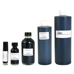May include: Five bottles of black fragrance oil in different sizes. The bottles are labeled "Old Edition" Black Woman Unique (W) and have product codes O-8731, O-8734, O-8738, and O-873L.