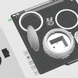 May include: A 3D printed model of a decorative box with a hinged lid. The box is made up of several pieces, including a base, lid, and decorative elements. The model is printed in white plastic and is shown on a black grid.