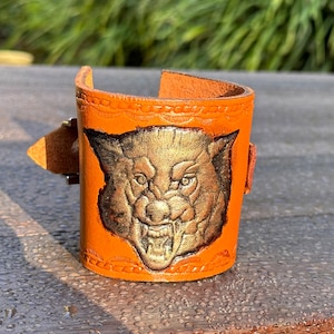 Genuine leather cuff bracelet, handmade embossed drawing head of wolf
