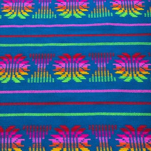 May include: A woven textile featuring a vibrant blue background with horizontal stripes in red, pink, and lime green. The fabric displays a repeating pattern of stylized, symmetrical floral motifs in a gradient of pink, orange, and yellow.