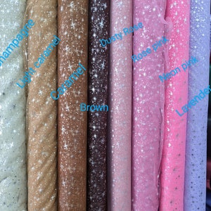 May include: Rolls of sheer fabric with a star pattern in various colors, including champagne, light caramel, caramel, brown, dusty rose, rose pink, neon pink, and lavender.