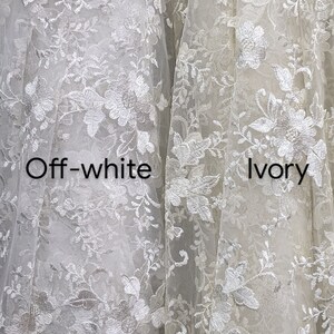 May include: Close-up of two fabrics, one off-white and one ivory, both with intricate floral lace patterns. The off-white fabric is on the left, and the ivory fabric is on the right. The text "Off-white" and "Ivory" are visible.