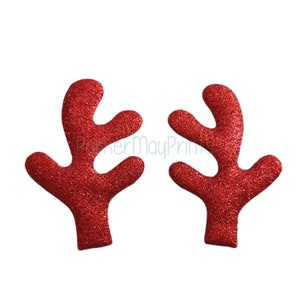 May include: Two red glitter reindeer antlers. The antlers are made of felt and have a sparkly finish.