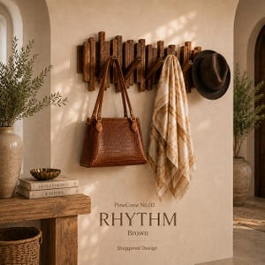 May include: A wall-mounted coat rack with a staggered wooden design, featuring a brown crocodile-textured handbag, a cream and gold patterned scarf, and a dark brown fedora hat. Text reads: PineCone No.02 RHYTHM Brown Staggered Design.