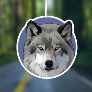 May include: A gray wolf with yellow eyes is depicted in a close-up view. The wolf's head is centered in the image, with a blue background.