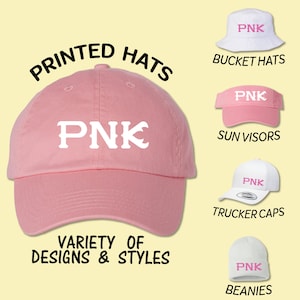 May include: A pink baseball cap with the word "PNK" in white letters. The image shows a variety of hats with the same logo, including bucket hats, sun visors, trucker caps, and beanies.