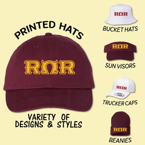 May include: Printed hats in a variety of styles and colors, including bucket hats, sun visors, trucker caps, and beanies. All hats feature the text "ROR" in gold lettering.