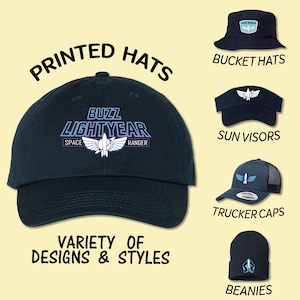 May include: A variety of printed hats featuring the Buzz Lightyear logo. The hats include a baseball cap, bucket hat, sun visor, trucker cap, and beanie.