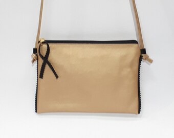Gold and black leather clutch