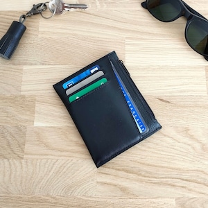 Cartera compacta de piel negra y gris