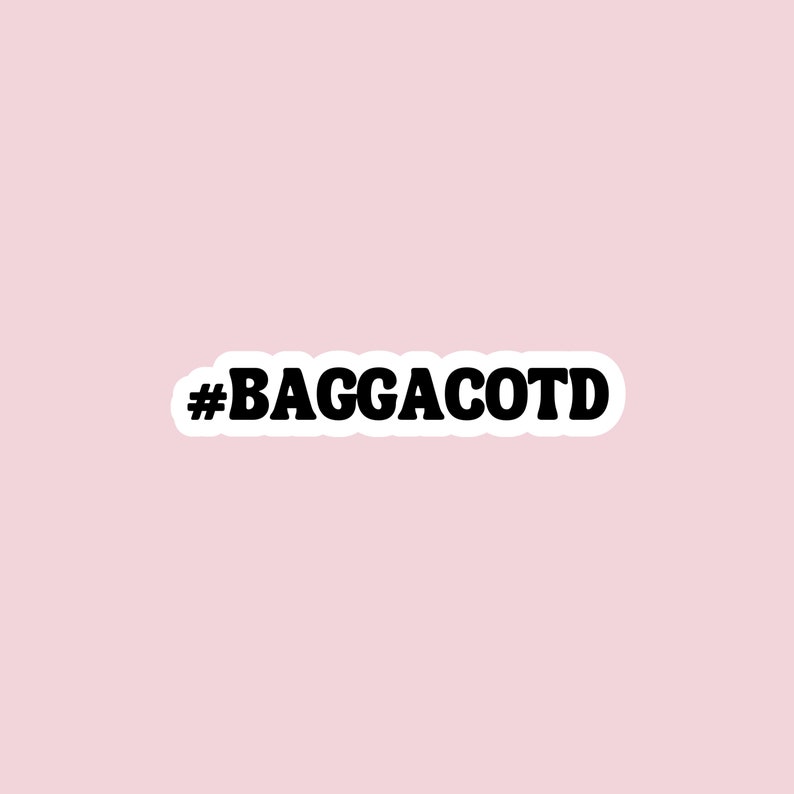 May include: Black and white sticker with the text "#BAGGACOTD" in a bold, retro font.